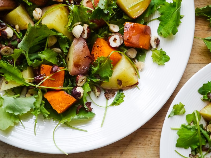 When you can't decide between potato and sweet potato, the answer is to clearly have a little bit of both. They pair perfectly with crunchy hazelnuts and a zesty, lemon-infused dressing in this recipe. When you can't decide between potato and sweet potato, the answer is to clearly have a little bit of both. They pair perfectly with crunchy hazelnuts and a zesty, lemon-infused dressing in this recipe.